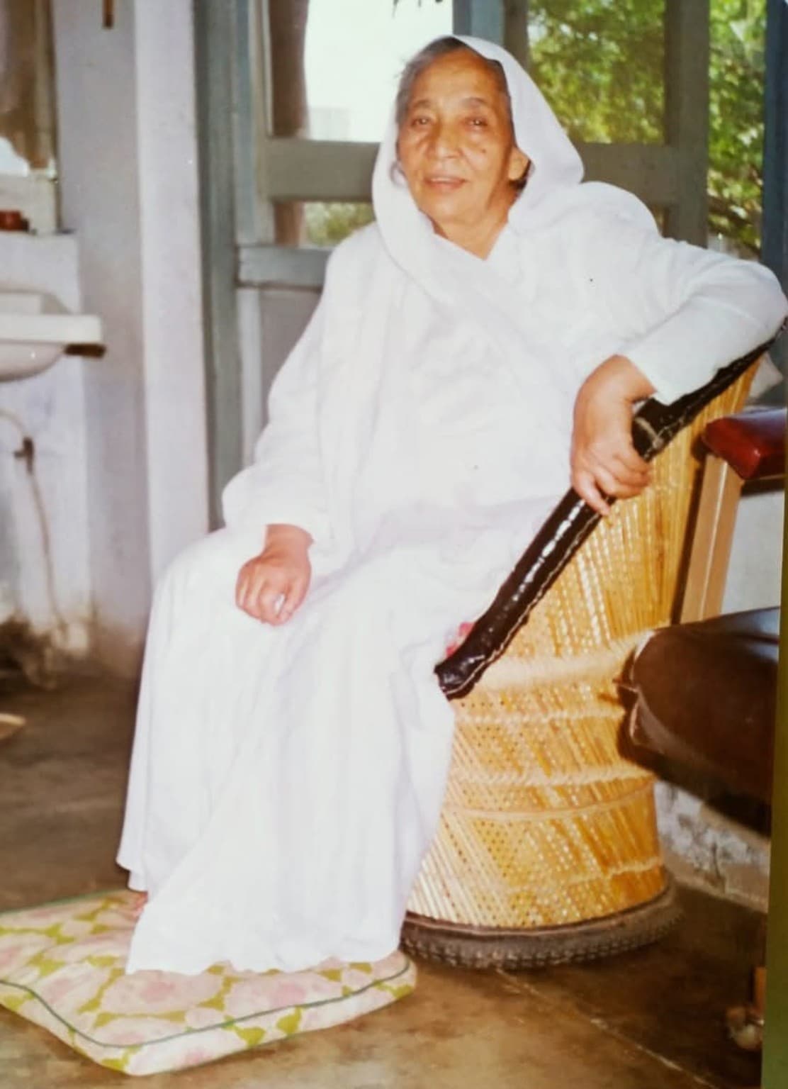 Ma seated in a cane chair at Sumati’s family home in Bareilly